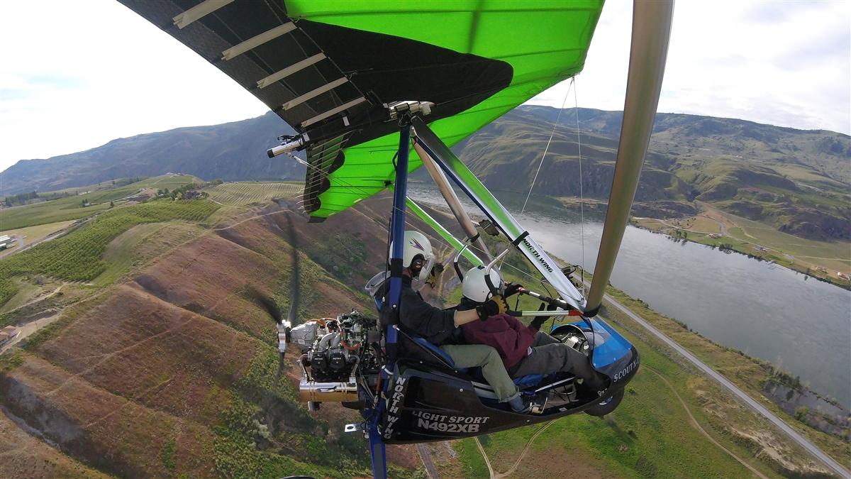A North Wing Scout XC Apache two-person trike Light Sport Aircraft powered by a Rotax 912UL engine cruises above the countryside. Photo courtesy of North Wing.
