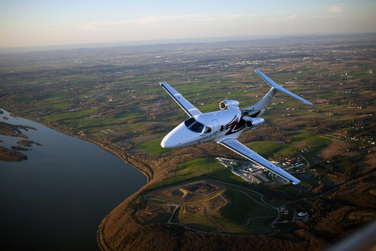 Aerial photography of Embraer's Phenom 100. Photo by Chris Rose.