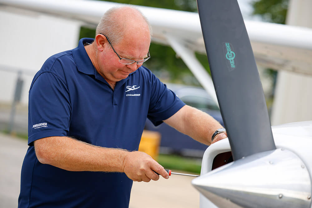 An aircraft mechanic inspecting an aircraft